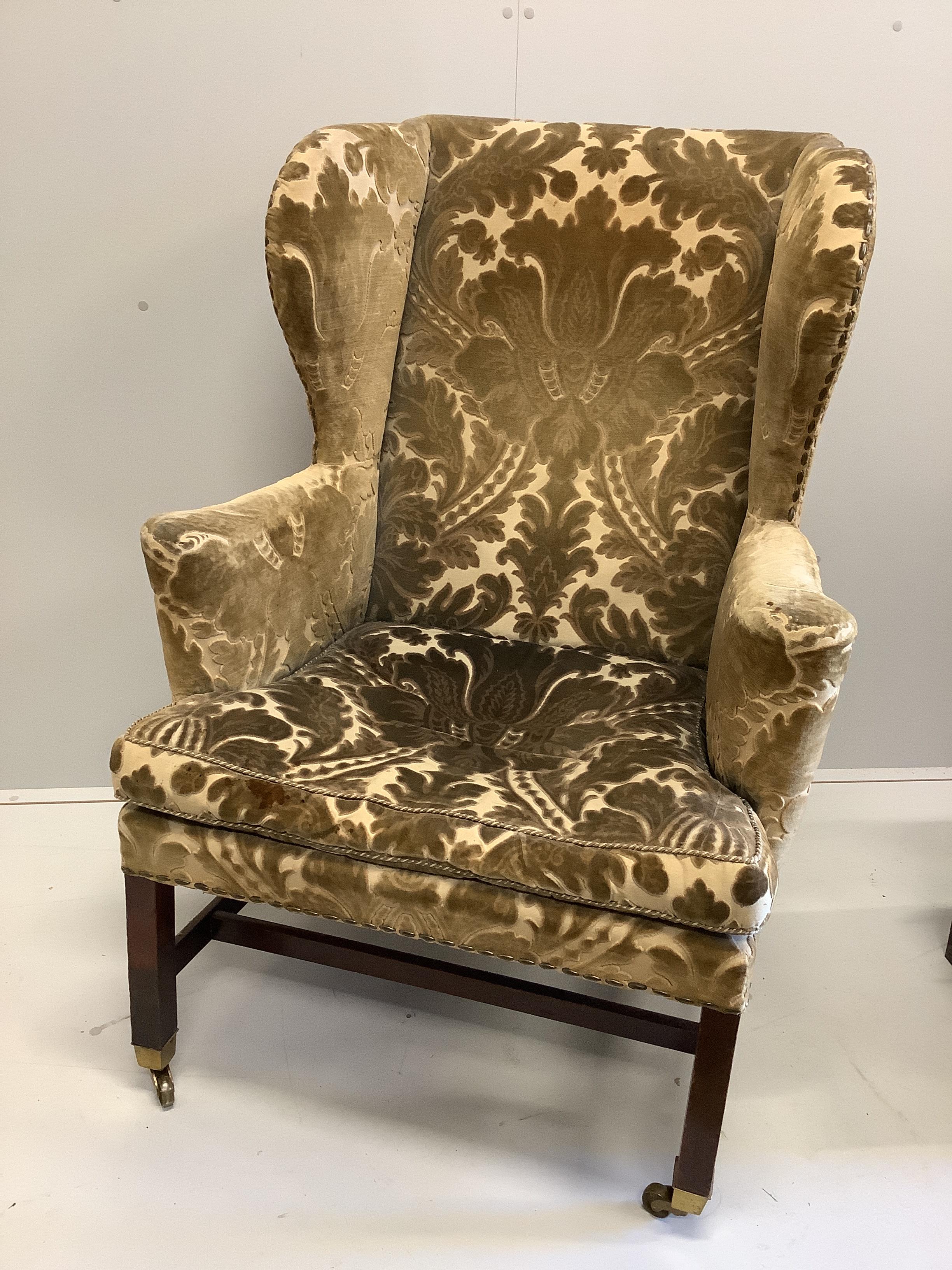 A George III mahogany velvet brocade wingback armchair, for use by Edward VII, width 84cm, depth 76cm, height 116cm